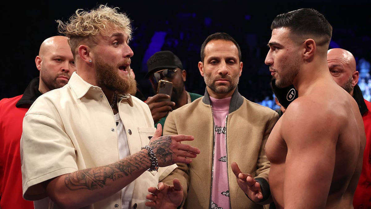 Jake Paul and Tommy Fury talk in ring