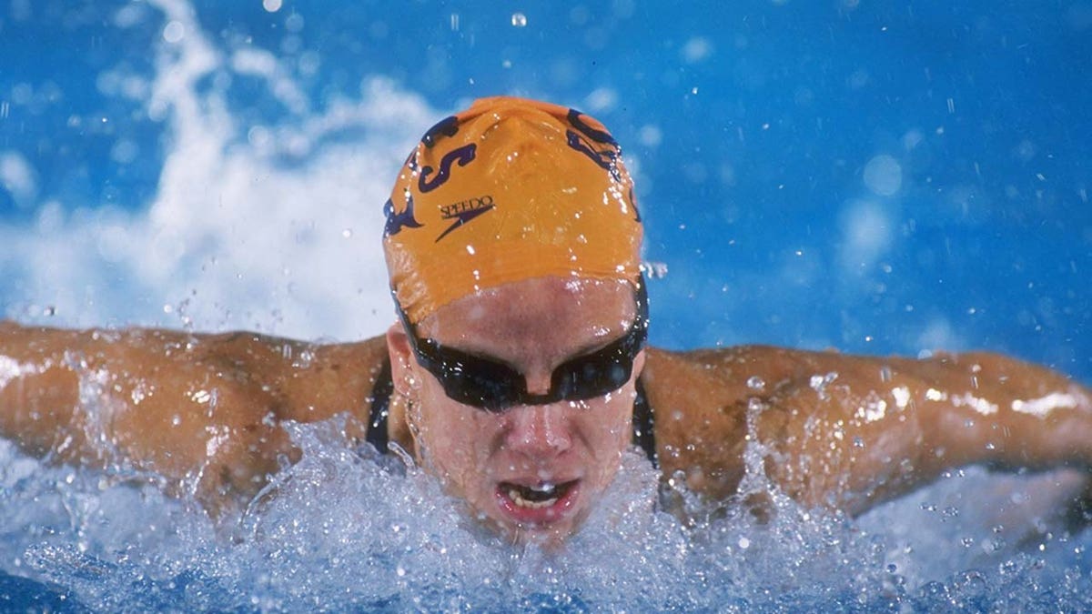 Jamie Cail swims in a competition.