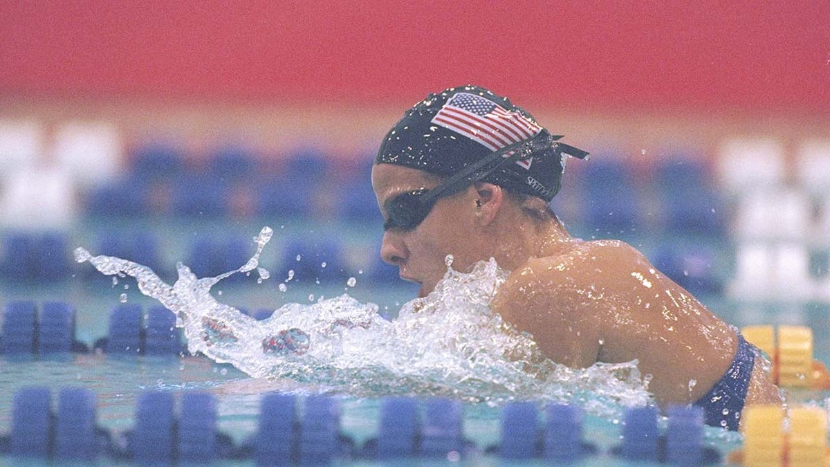 Jamie Cail swims in a competition.