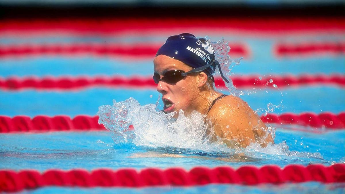 Jamie Cail swims in a competition.
