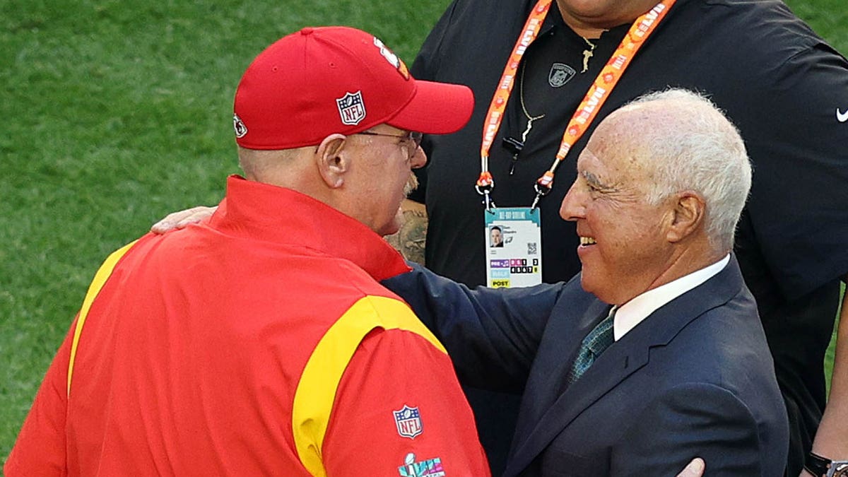 Jeffrey Lurie and Andy Reid embrace before Super Bowl LVII