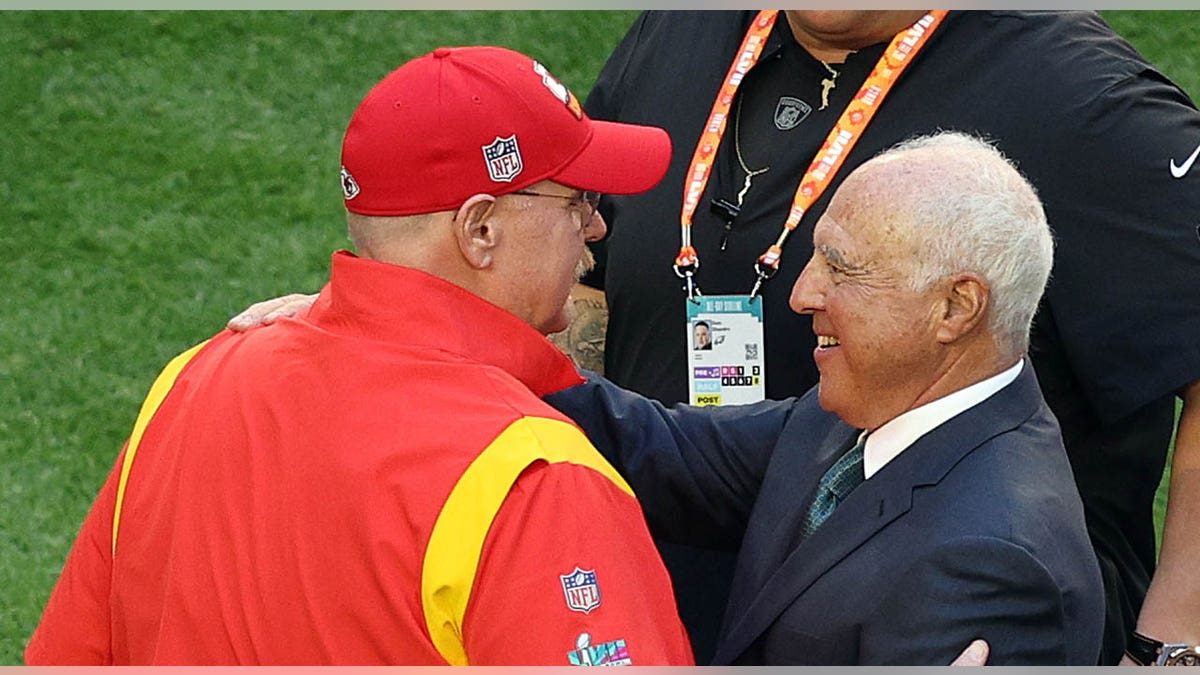 Jeffrey Lurie and Andy Reid embrace before Super Bowl LVII