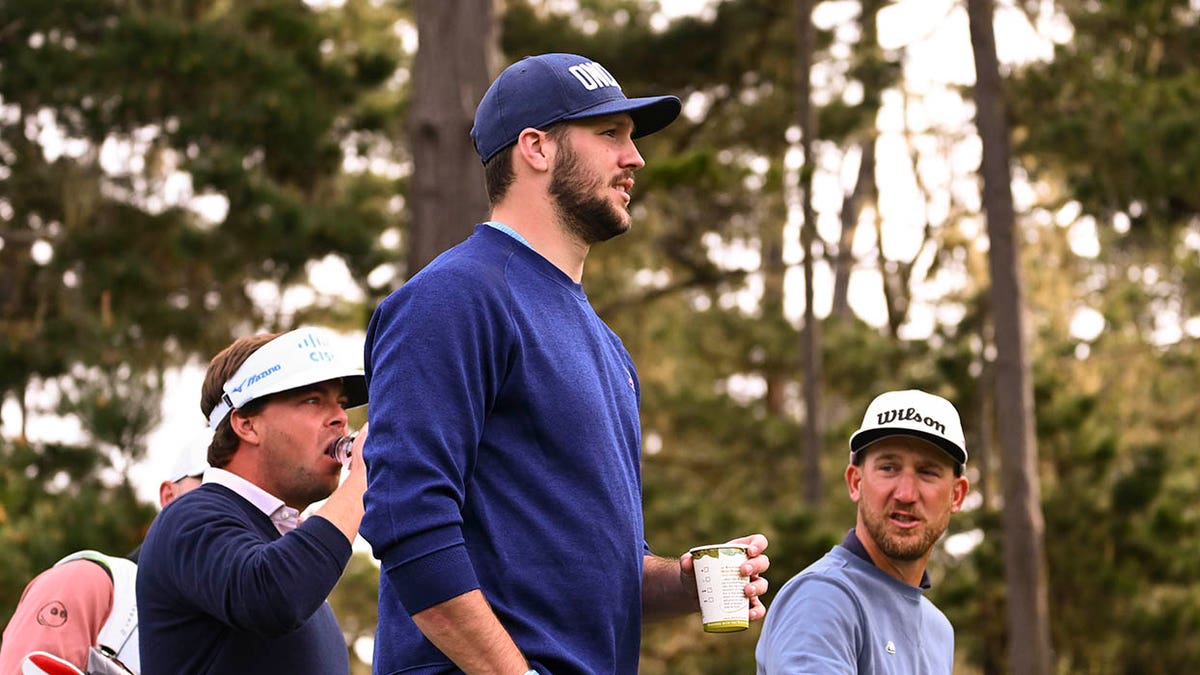 Josh Allen looks on golf course