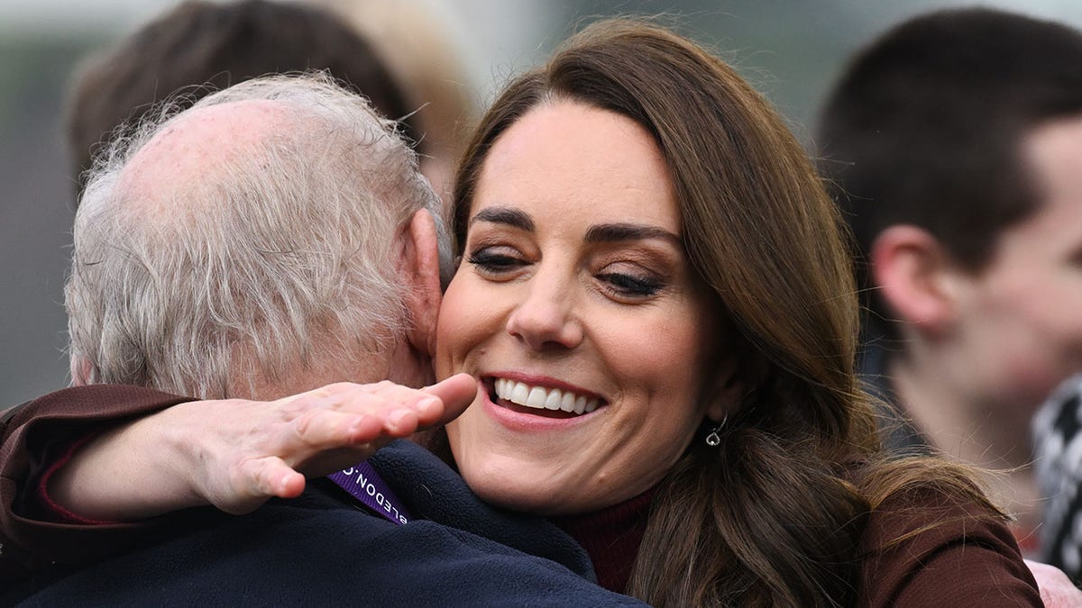 Kate Middleton hugs her former teacher