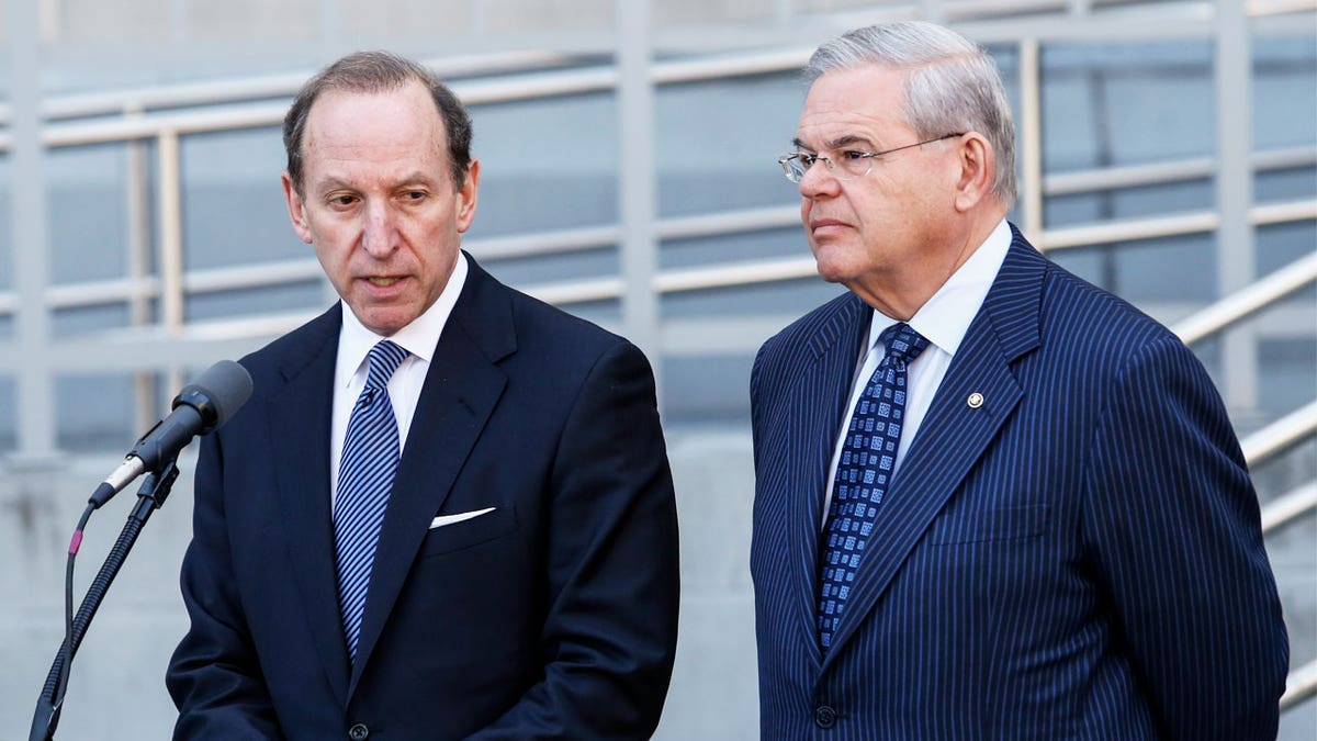 Abe Lowell and Sen. Robert Menendez speak to reporters