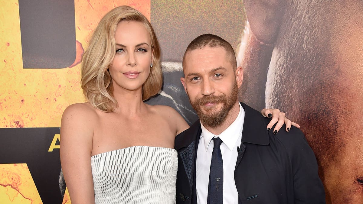 Charlize Theron and Tom Hardy on red carpet