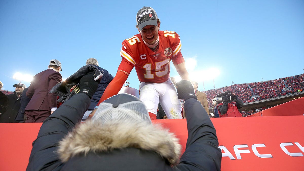 Patrick Mahomes celebrates after a game with his father