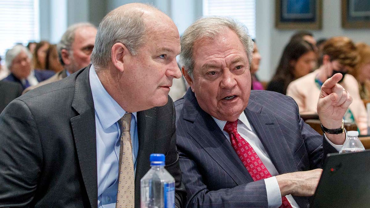 Jim Griffin and Dick Harpootlian speak to each other during the trial.