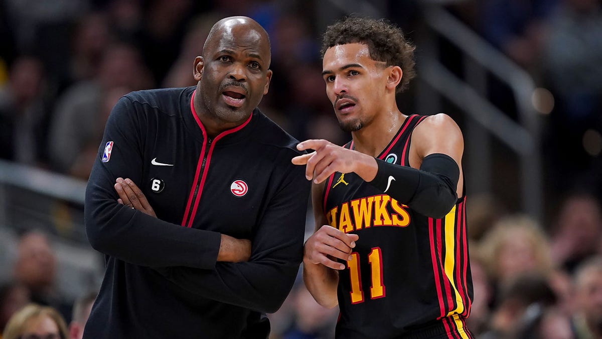 Nate McMillan meets with Trae Young
