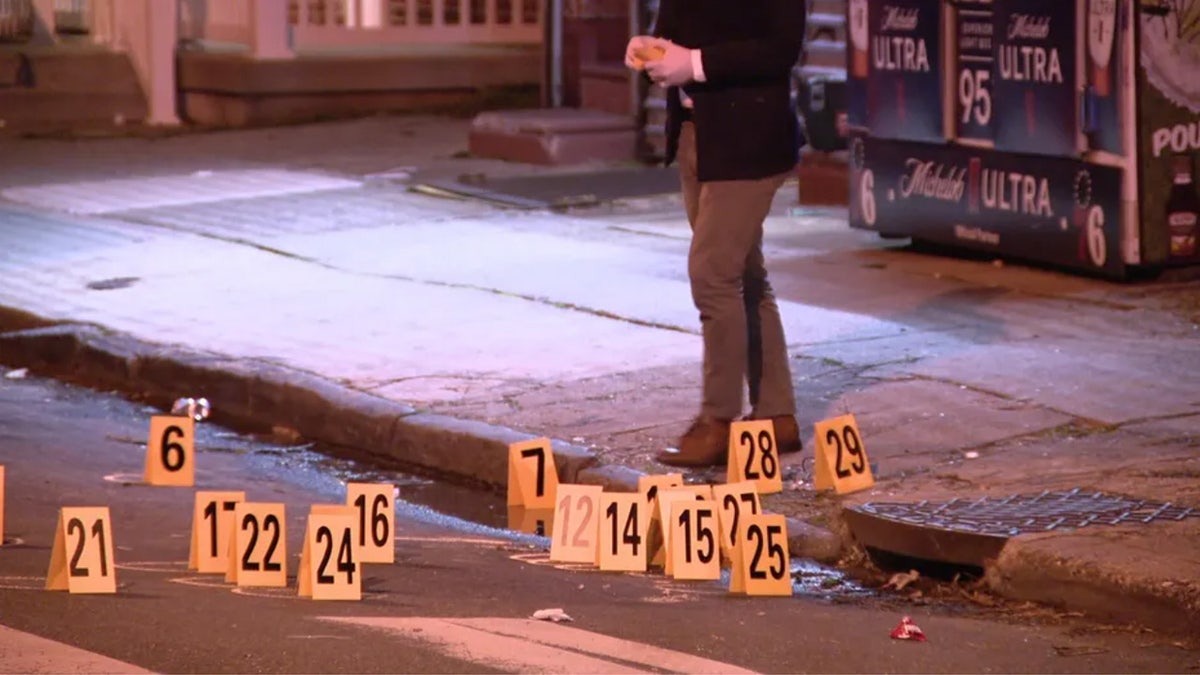 Evidence markers are placed near the scene of a shooting in Philadelphia