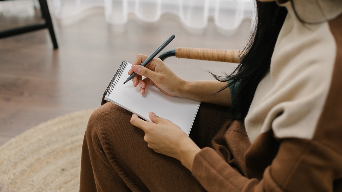 psychologist with pen, notepad stock image
