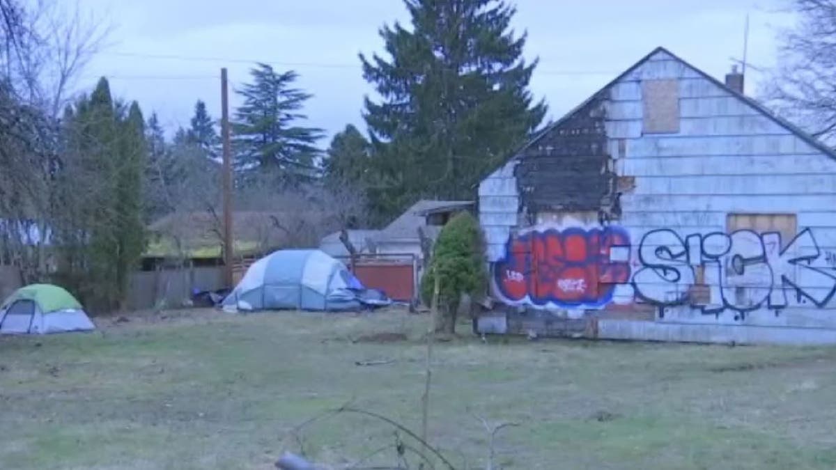 Portland squatter camp, graffiti-covered building