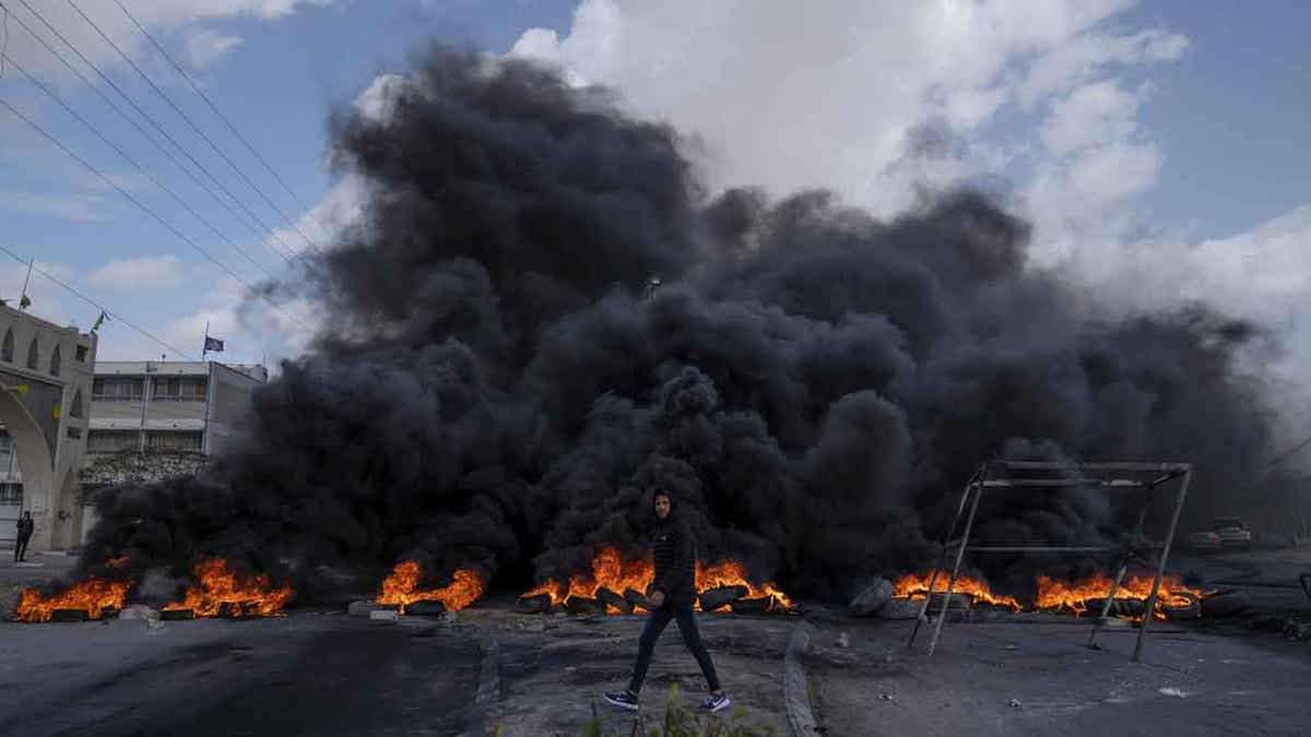 Palestine protestors block a road