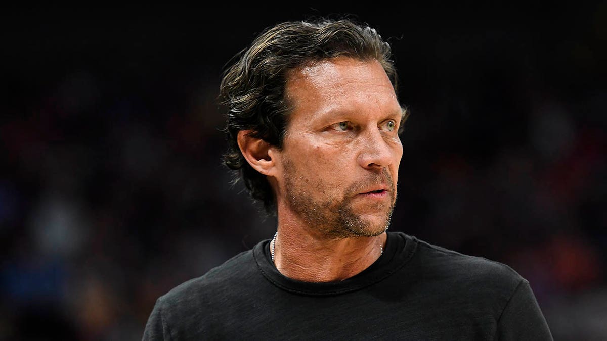 Quin Snyder looks on court