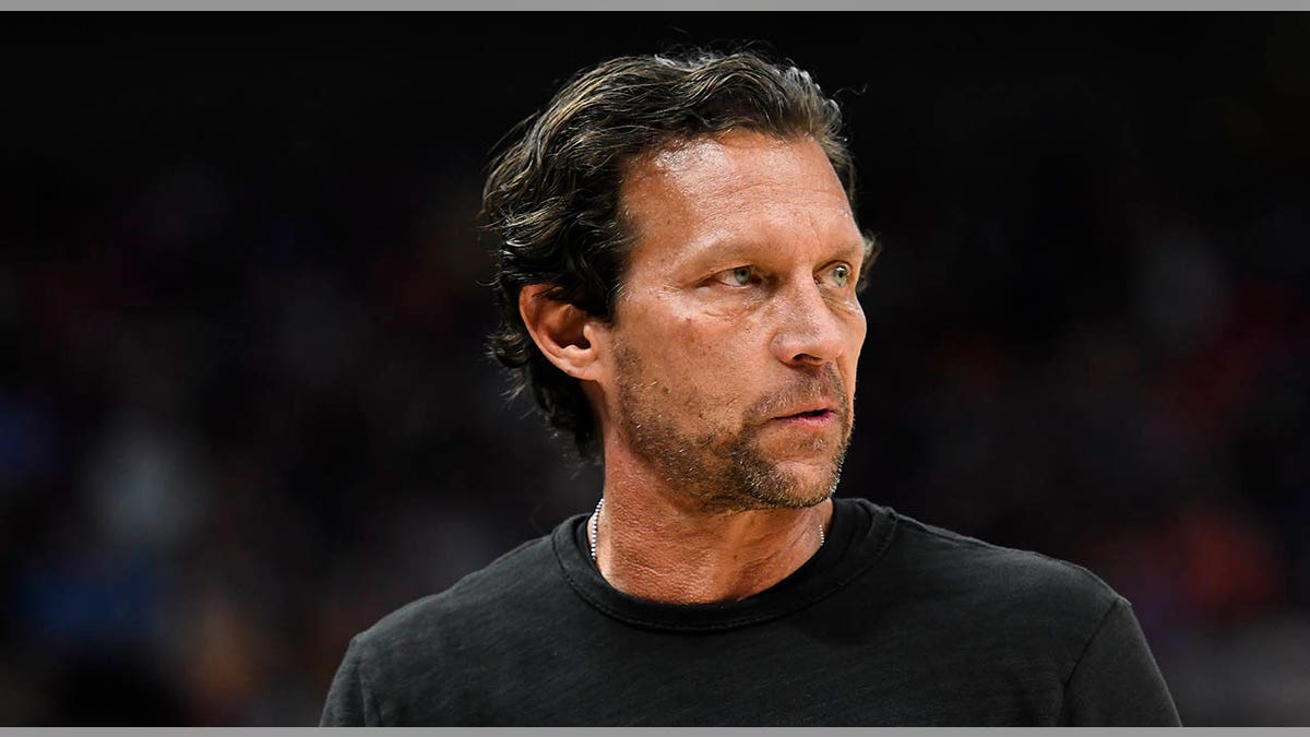 Quin Snyder looks on court