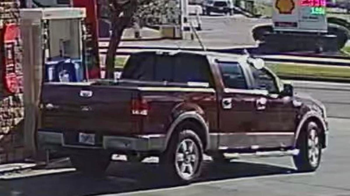 A maroon Ford King Ranch truck parked at an Exxon gas station in Houston