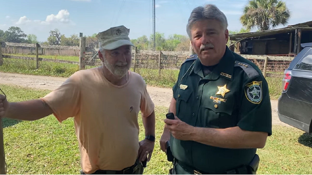 Hernando County Sheriff poses with search volunteer who found JJ Rowland