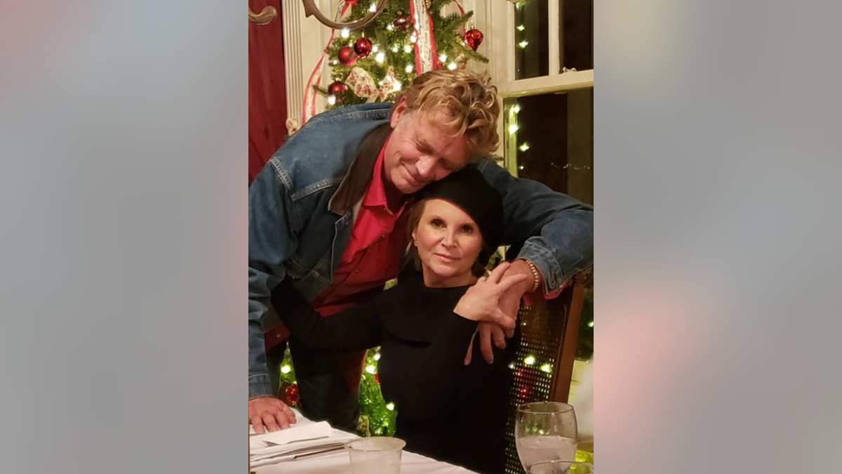 John Schneider with his wife Alicia holiday photo