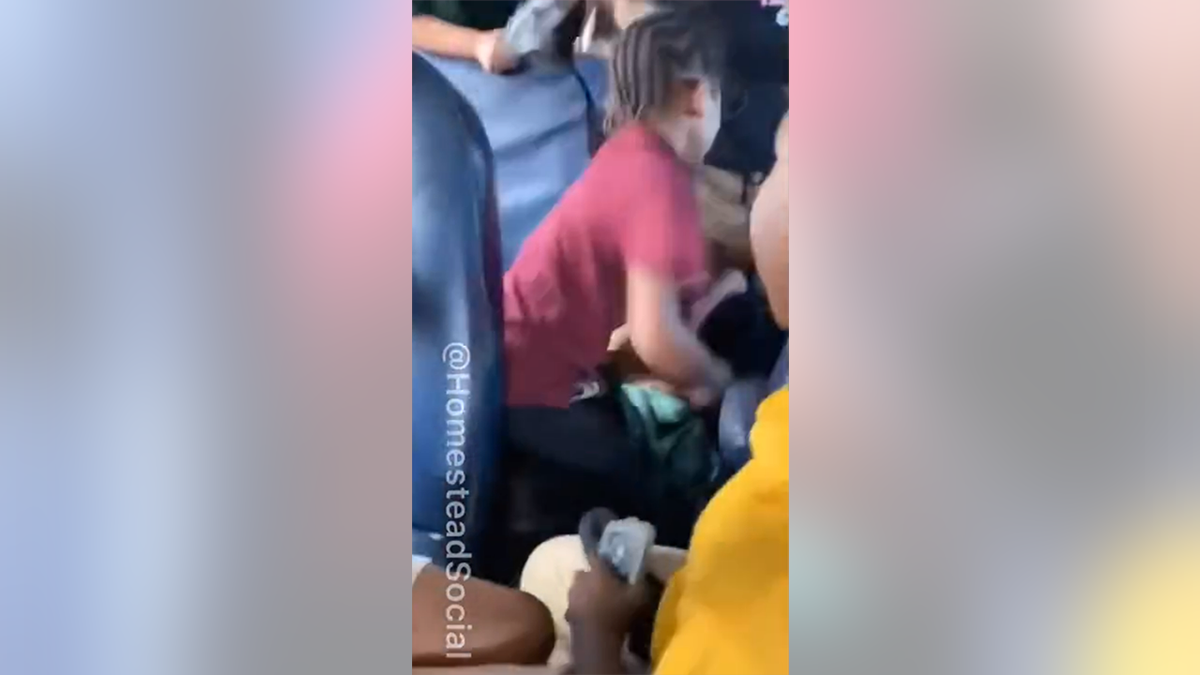 A second student hitting the girl
