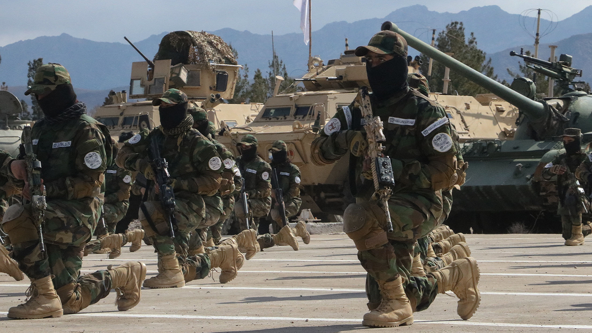 Taliban security forces line up