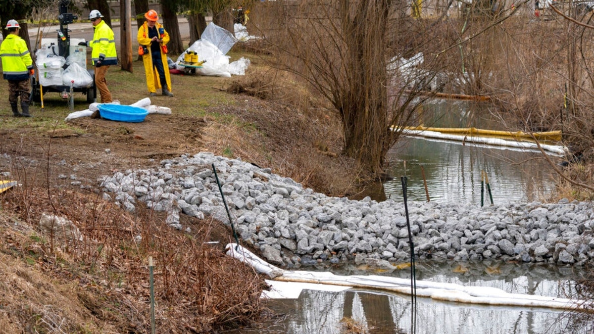 Cleanup continues in a stream in East Palestine