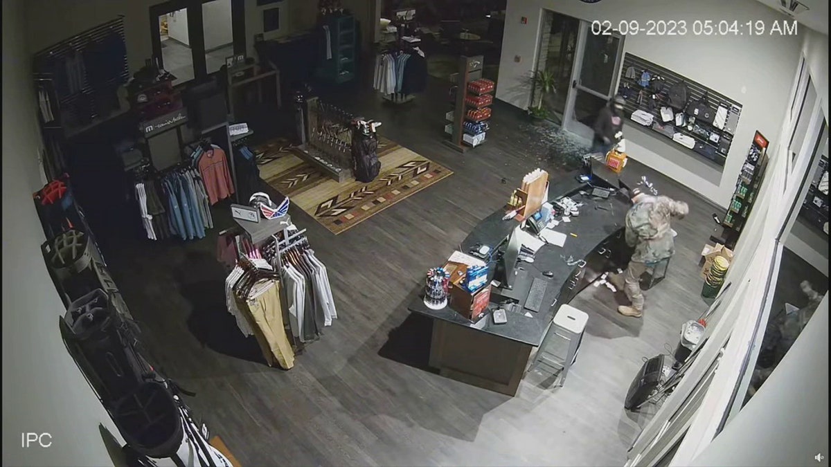 burglars stealing cash register