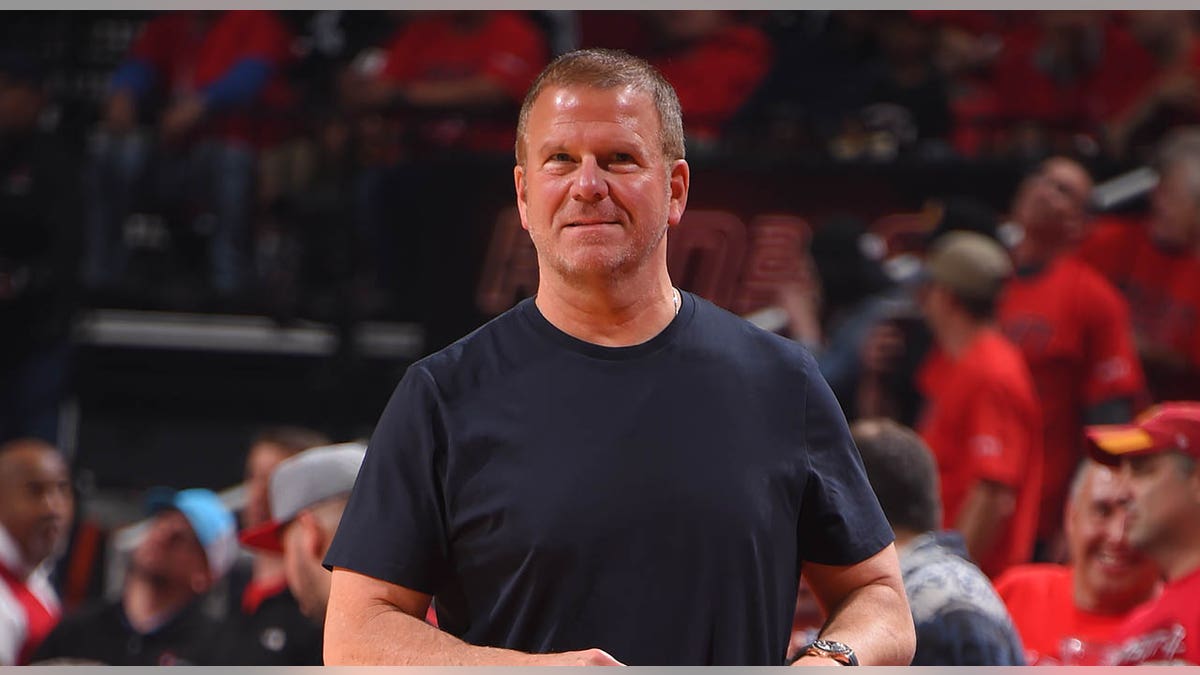 Tilman Fertitta on court