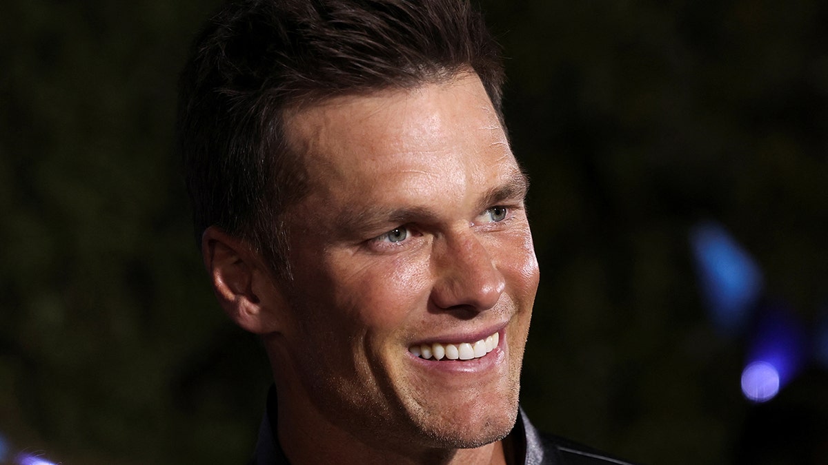 Tom Brady smiles for the camera