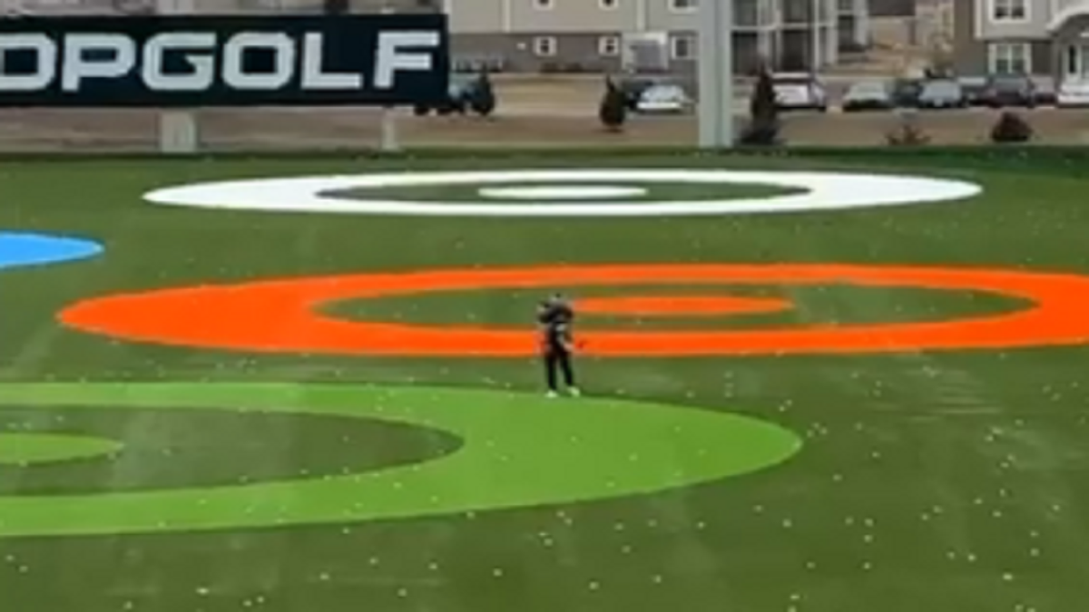 Child caught after running onto Topgolf driving range