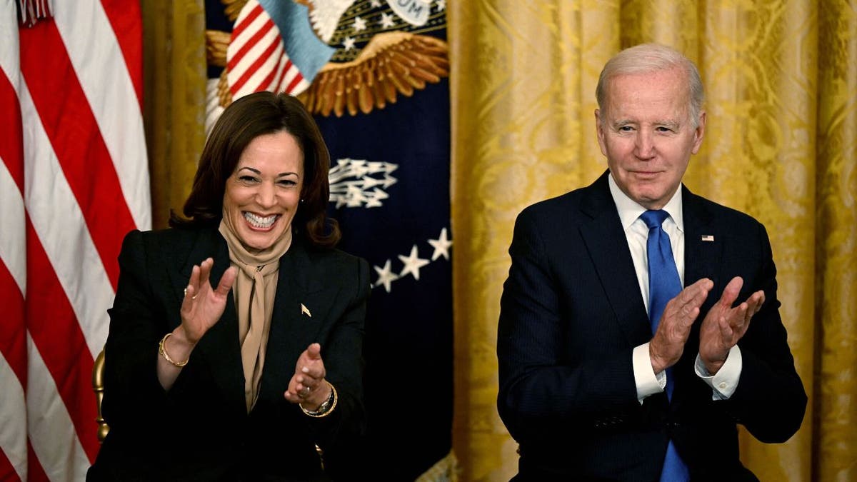 Kamala and Joe Biden clap during a White House conference