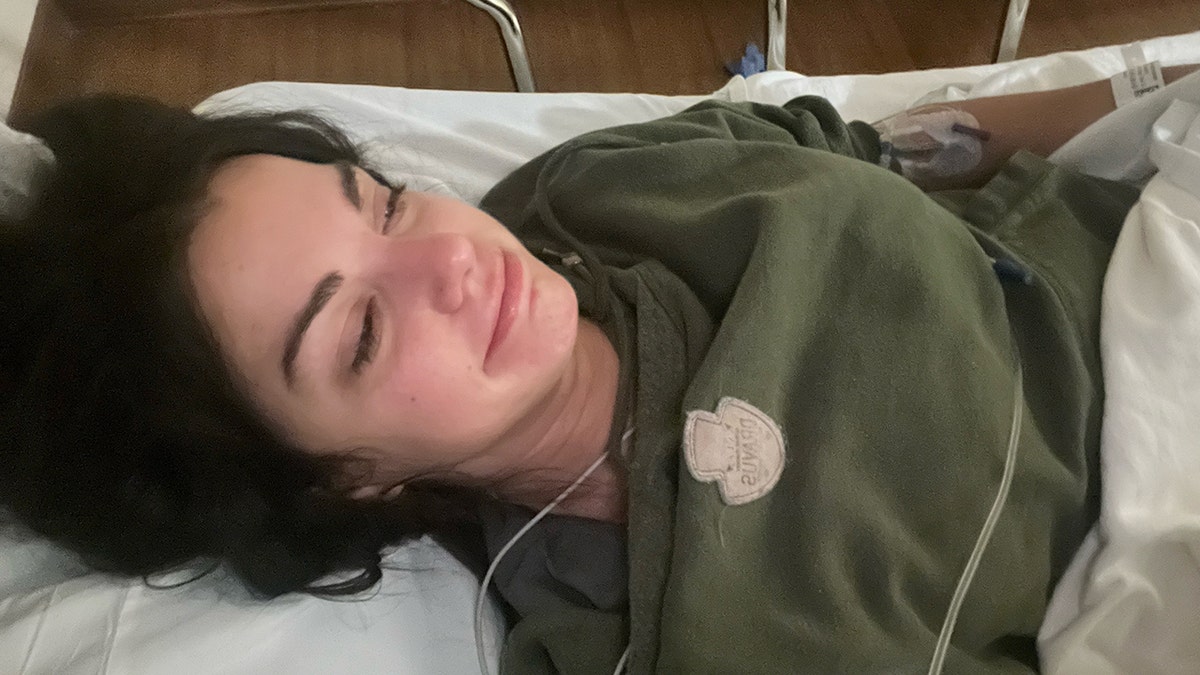 Victoria Vesce on a hospital bed after having a ministroke