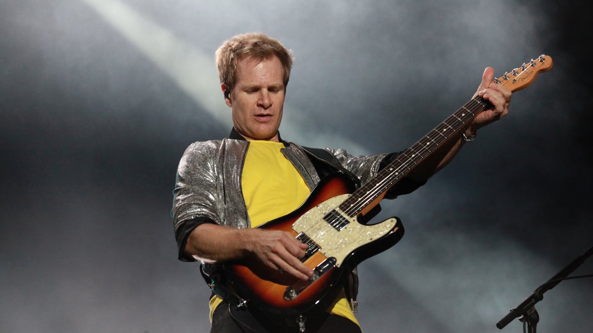 Andy Taylor plays guitar in Duran Duran concert
