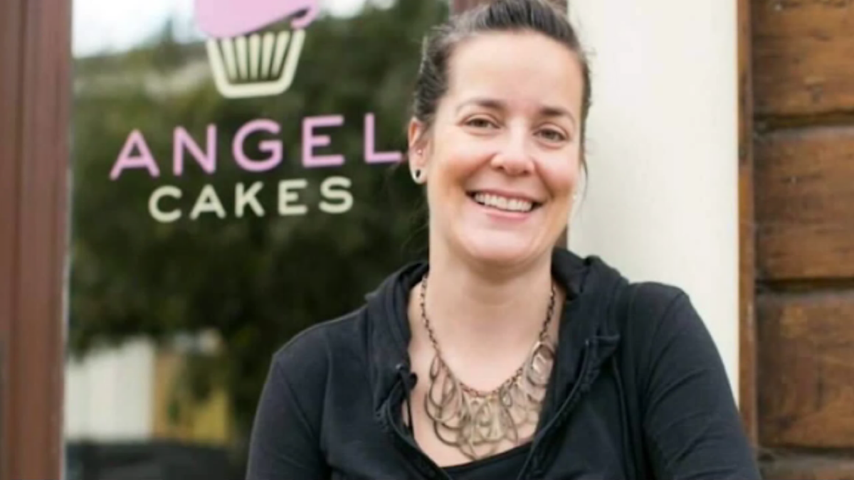 Jen Angel smiling outside business