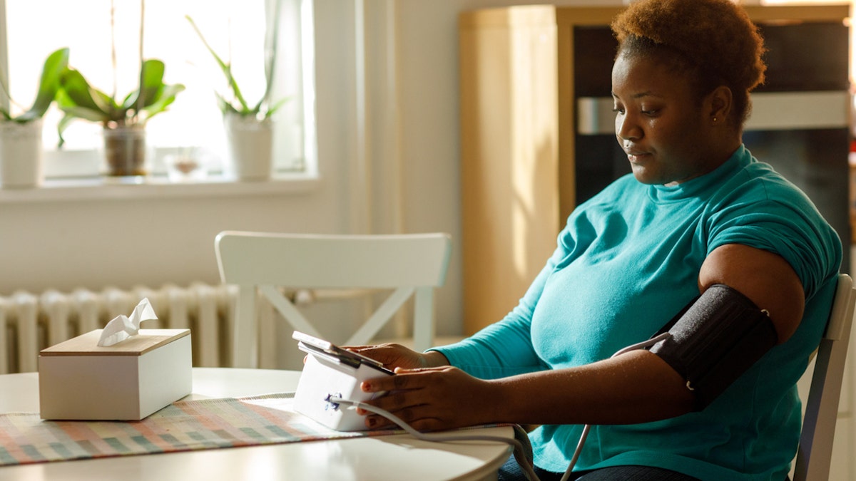 Woman gets blood pressure taken