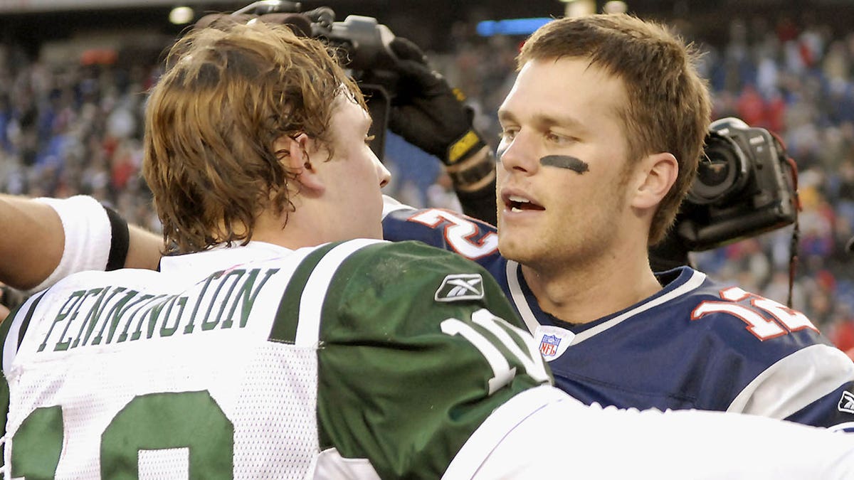 Chad Pennington and Tom Brady hug