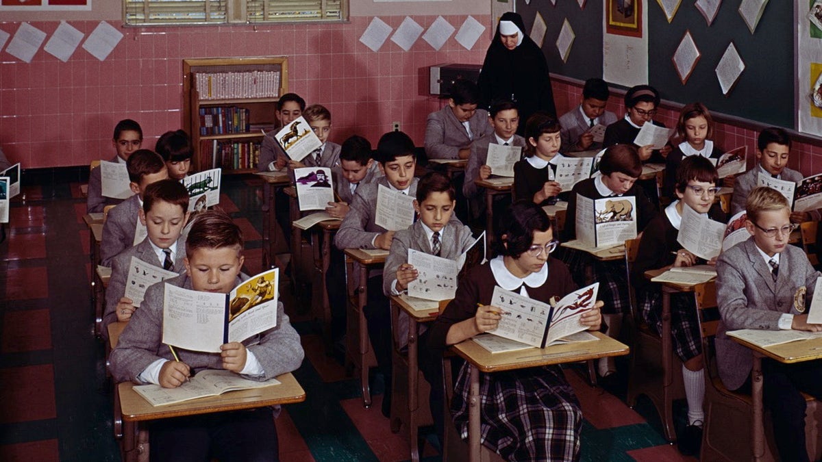 Children sit at desks in religious school as school choice debate continues 