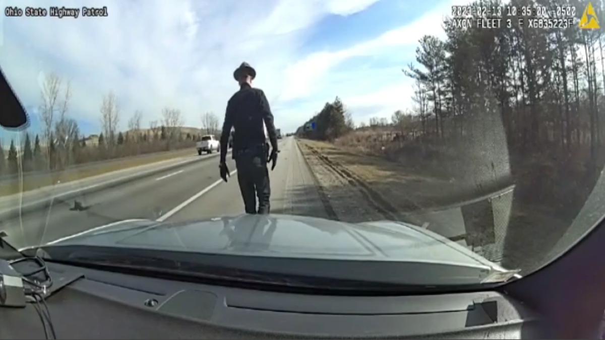 Officer walking on road before crash