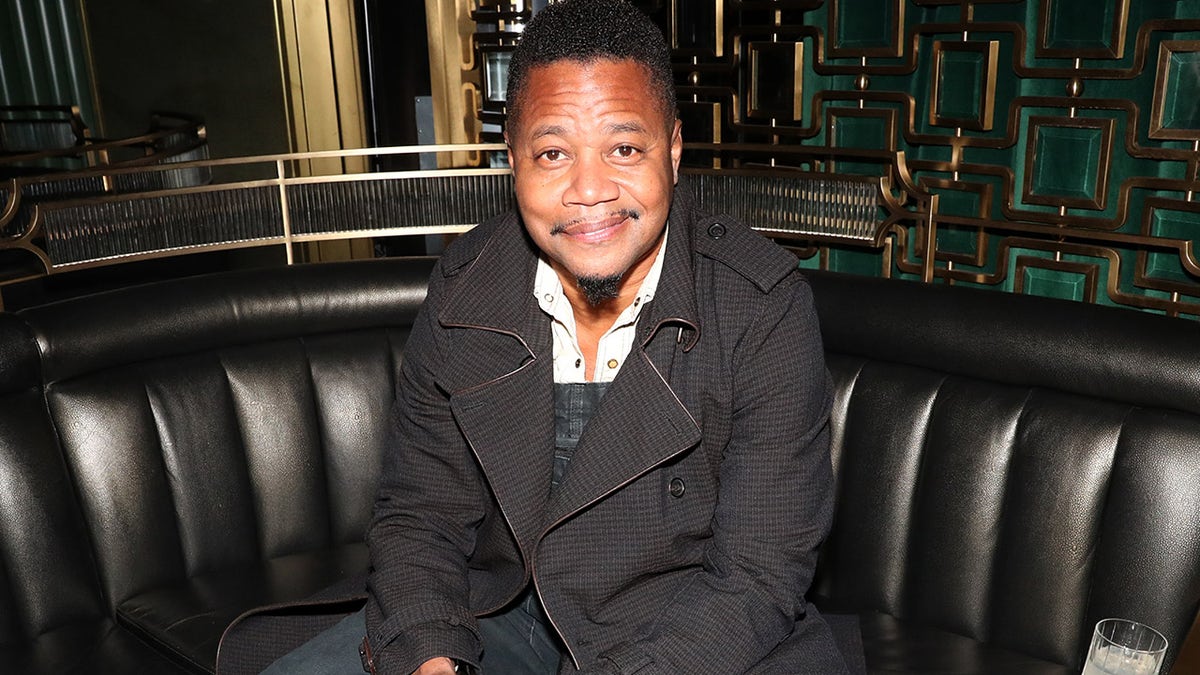 Cuba Gooding Jr. smiles at restaurant opening