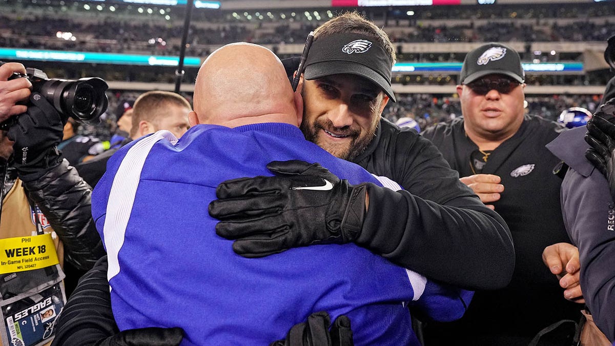 Nick Sirianni hugs Brian Daboll