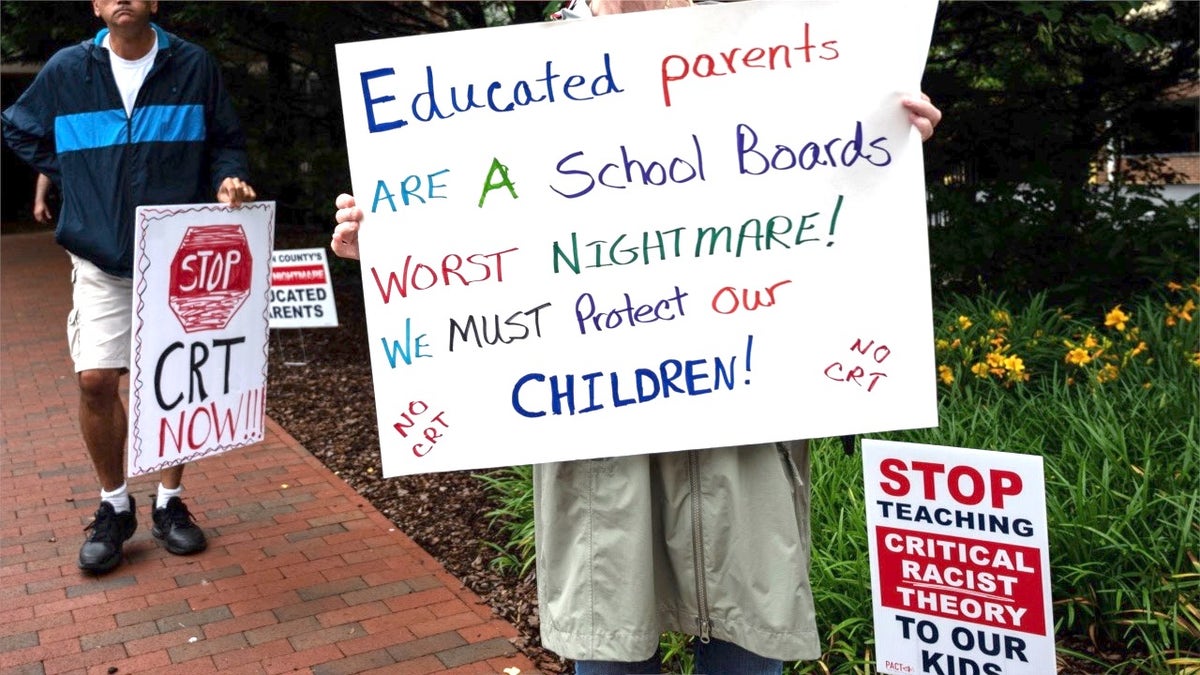 Parents protest against CRT with signs pointed at school boards