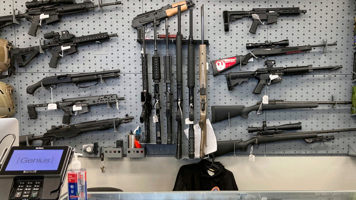 Firearms are displayed at a gun shop in Salem, Ore.