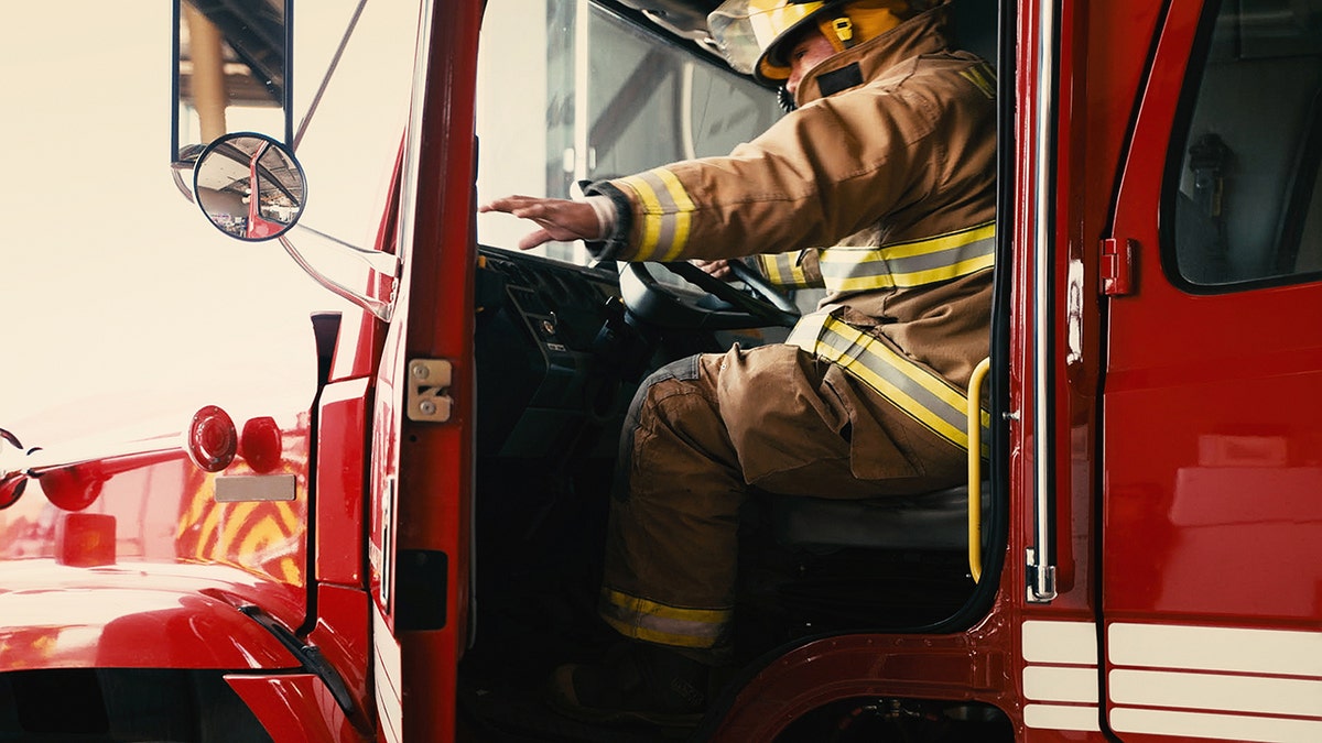 firefighter opening engine door