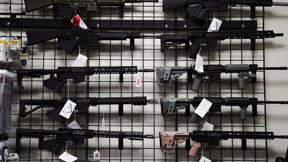 rifles on wall display rack