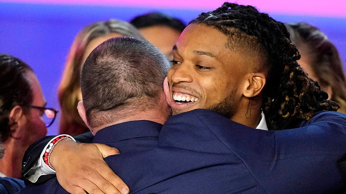 Damar Hamlin hugging medical staff