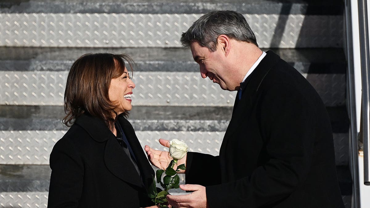 Kamala Harris smiles with Markus Soder at ariport in Germany