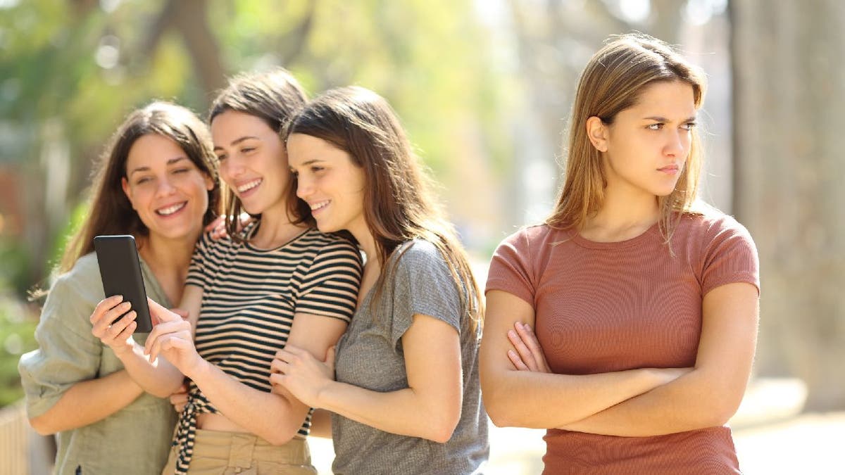 Woman appears to be excluded from friend group