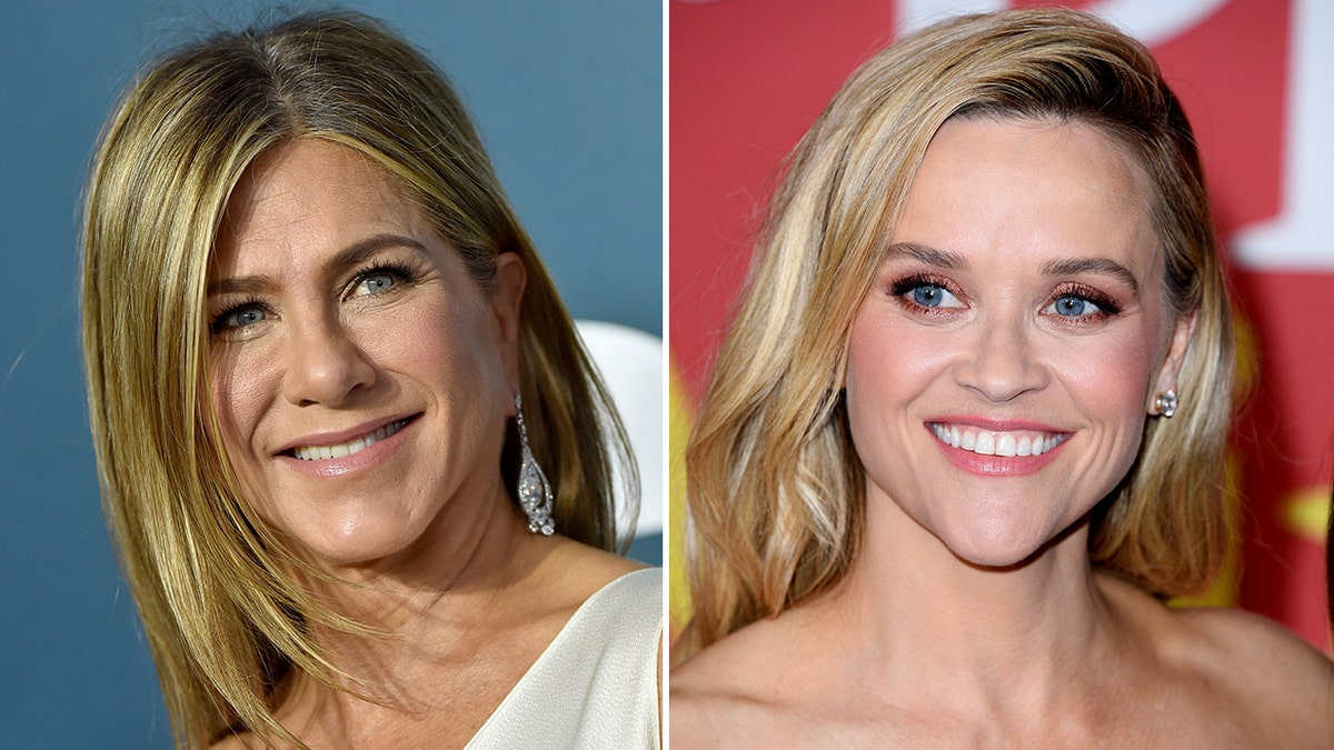 Jennifer Aniston looks to the viewers right with flowing hair in a satin white dress split Reese Witherspoon looks to the viewers left