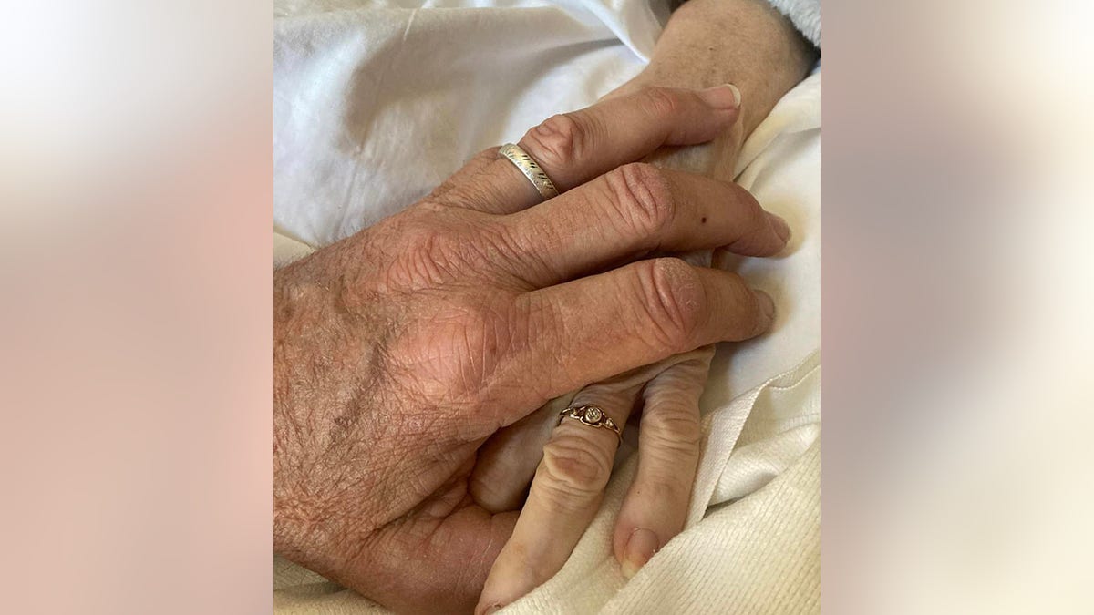 John Schneider posts a photo to his Instagram holding his wife's hand, in the announcement of her death