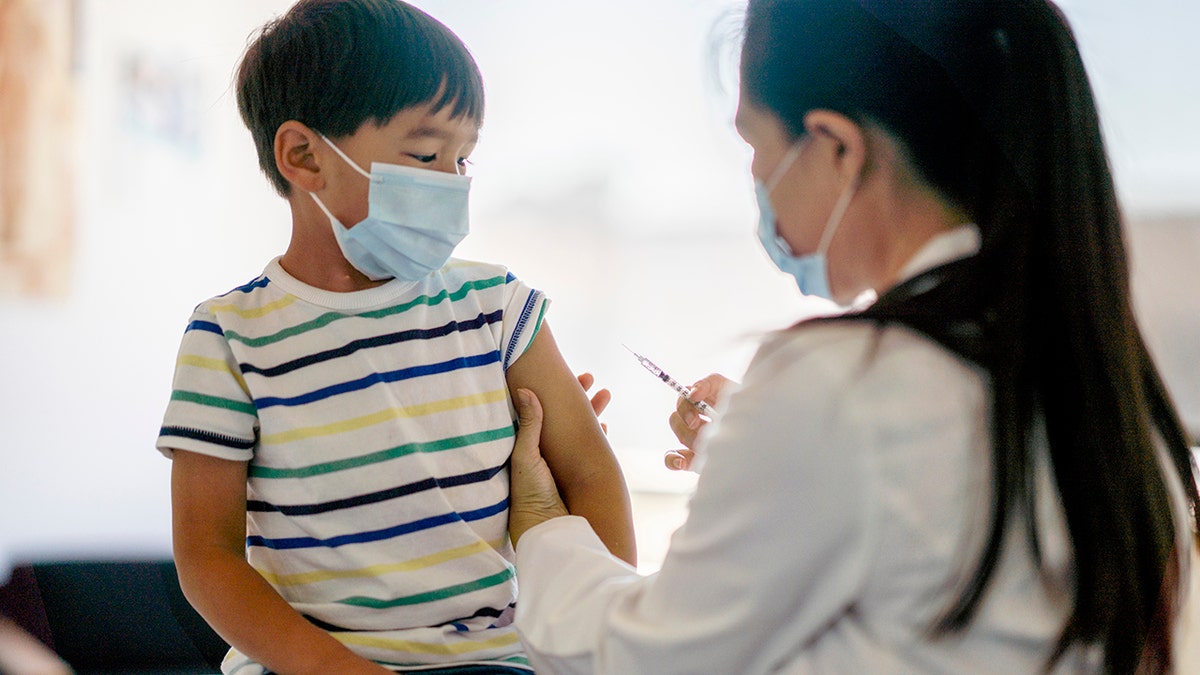 little boy getting a vaccine