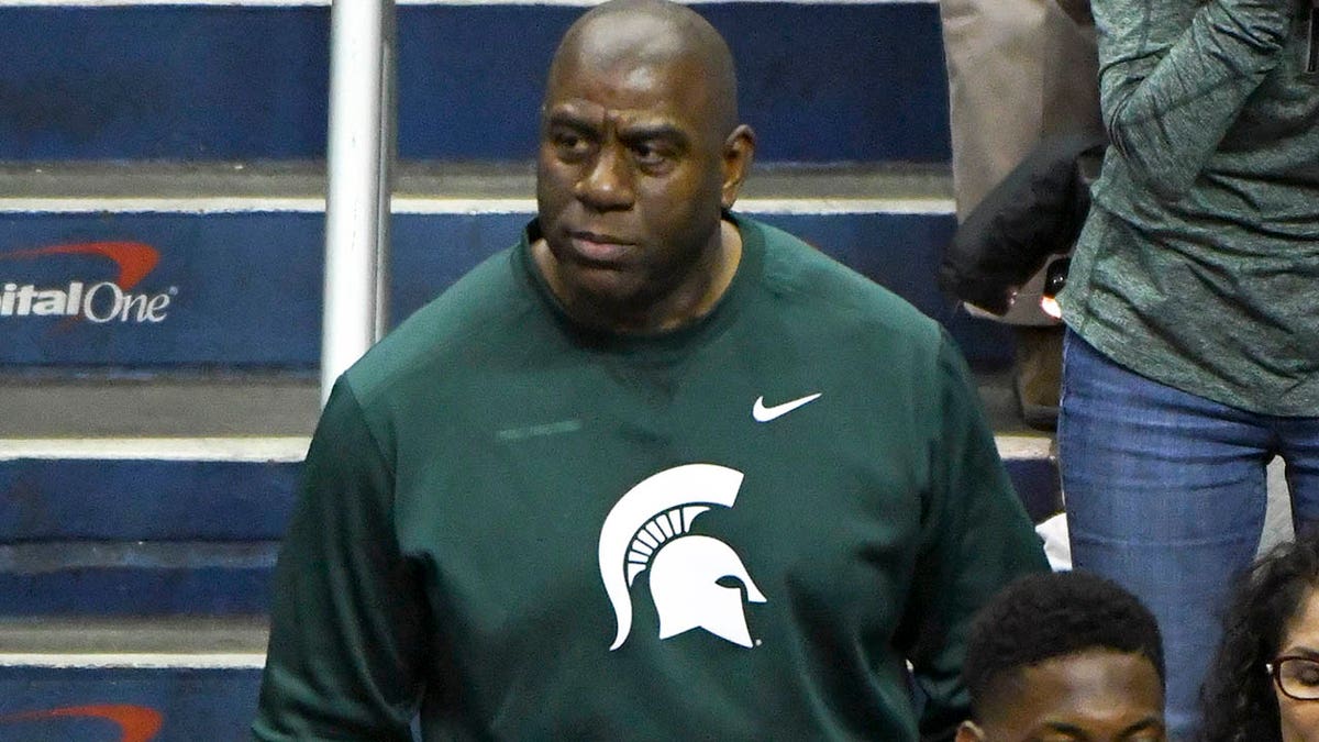 Magic Johnson attending spartans game